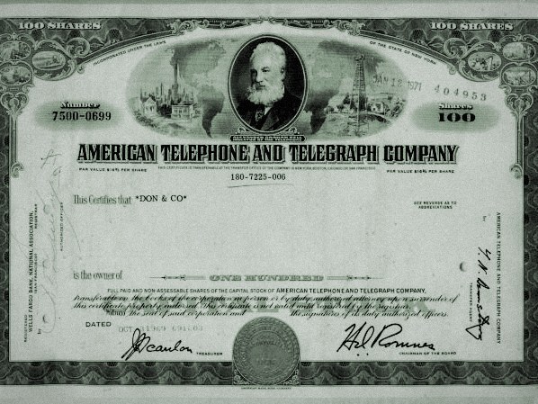 Hand holding an engraved certificate plate